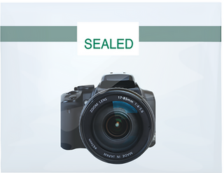 Digital camera with 'SEALED' label on a light blue background