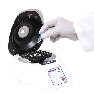 Laboratory Oxford Benchmate C1216V Microcentrifuges with a person wearing gloves and holding a test tube.