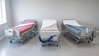 Three powered therapeutic mattress systems side by side showing alternating pressure, low air loss and lateral rotation therapy