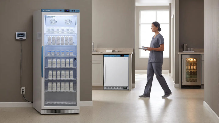 Clinic corridor showing an upright vaccine refrigerator, a built-in undercounter medical unit and a staff beverage center in one facility