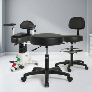 Doctor sitting on an ergonomic, pneumatic adjustable physician stool with a backrest in a modern medical examination room.