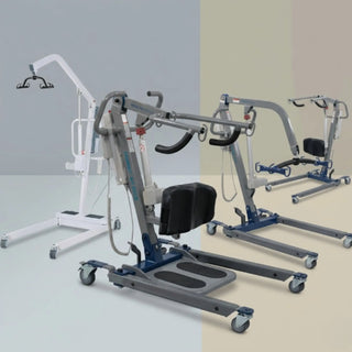 aregiver safely using a medical sit-to-stand patient lift to assist a senior standing up from a wheelchair
