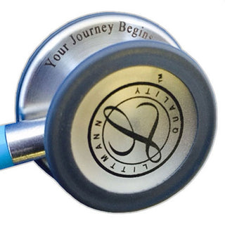 Stethoscope with 'Your Journey Begins' engraving on a white background