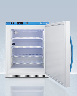 White OMCUBE Breast Milk Freezer with open door on a light blue background