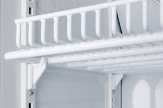 White metal shelf inside a refrigerator with a light gray background