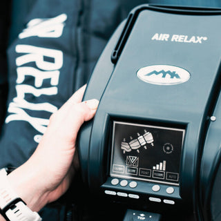 Hand holding the Air Relax Classic AR-2.0 control unit