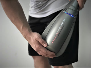 Air Relax Hammerz massager used on the thigh