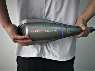 Air Relax Hammerz massager used on the lower back
