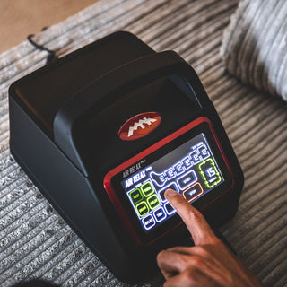 Hand selecting a mode on the Air Relax Pro AR-4.0 touchscreen control unit