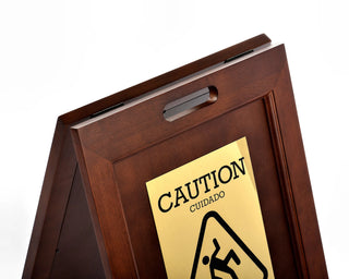 Alpine Industries ALP499 wet floor sign close-up of the carry handle and bilingual brass plate