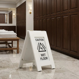 Alpine Industries ALP499G white wet floor sign standing on a polished marble floor in an upscale locker room