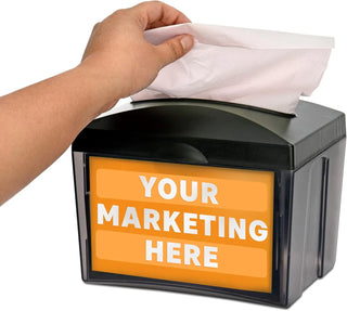 Alpine Industries ALP4332 hand pulling a napkin, dispenser shown with an orange sample advertising insert