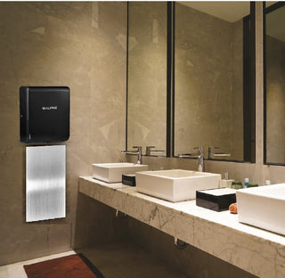 Alpine Industries ALP405-10 Willow hand dryer in black mounted above a wall guard in a marble restroom