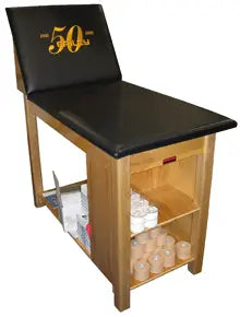 Bailey Manufacturing Model 25 Deluxe Taping Table with black cushion and wooden frame on a white background