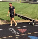 Bailey Manufacturing Model 28 Portable Sideline Mobile Athletic Treatment Table on a sports field