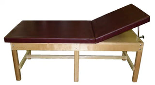 Bailey Manufacturing Model 4515 Adjustable Back Bariatric Treatment Table with maroon top on a white background