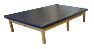 Bailey Manufacturing Model 454/456/457 Upholstered Top Mat Tables with a blue top and wooden legs on a white background