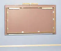 Bailey Manufacturing Model 458 Wall Mounted Mat Platform with gold frame on a gray background