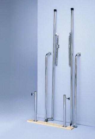 Bailey Manufacturing Model 595 Wall Mounted Folding Parallel Bars with adjustable legs on a light blue background