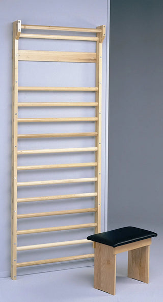 Bailey Manufacturing Model 775 Stall Bars with a black cushioned bench against a gray background