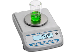 Digital laboratory Benchmark Scientific Accuris™ Compact Balance with a beaker of green liquid on a white background
