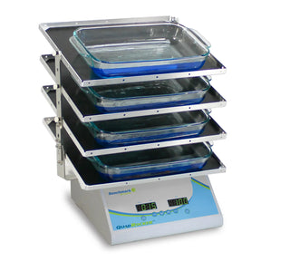 Stack of glass containers on a Benchmark Scientific BR5404 Benchmark QuadRocker™ with a white background