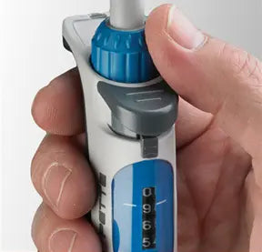Close-up of a hand holding a Benchmark Scientific NextPette™ Precision Pipette.