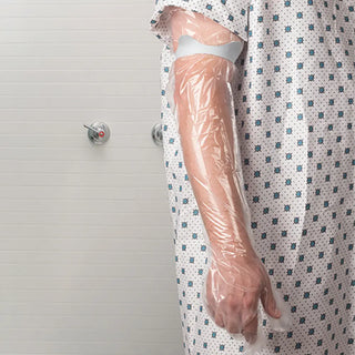 SEAL-TIGHT SealBand single-use dressing protectors for arm and leg with transparent moisture-resistant sleeves, individually packaged in boxes of 50 for protecting casts, PICC lines, IV sites, and surgical sites.