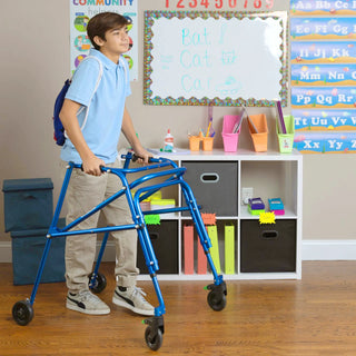 Circle Specialty KLIP Lightweight Gait Trainer KP4XX walker in a classroom setting with educational posters and supplies.