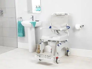 Clarke Healthcare A1641988 Aquatec Ergo Shower Chair in a bathroom setting with a sink and towel.