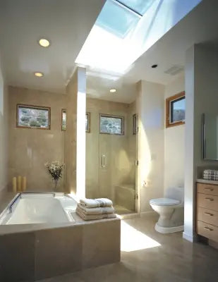 Modern bathroom with a skylight, bathtub, and Clarke Healthcare AHXXX Toilevator Elevated Toilet Platform and toilet.