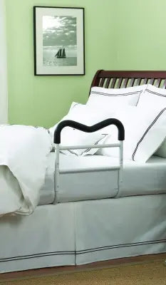 Bed with a wooden headboard and white bedding, Clarke Healthcare HMR400NW M-Rail Bed Rail