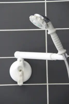 White shower head and Clarke Healthcare R1499202S Mobeli Shower Head Positioner With Swivel Arm on a tiled wall background