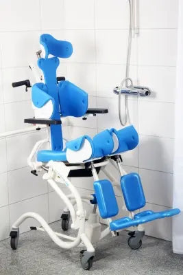 Blue and white Clarke Healthcare Z68941X Zitzi Starfish Pro Hydraulic Size 1 Combined Shower-Commode Chair, Special Order against a tiled bathroom wall.