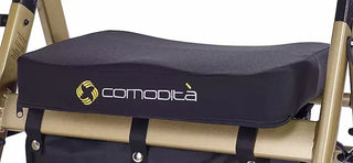 Black cushion with 'comodita' logo attached to a chair