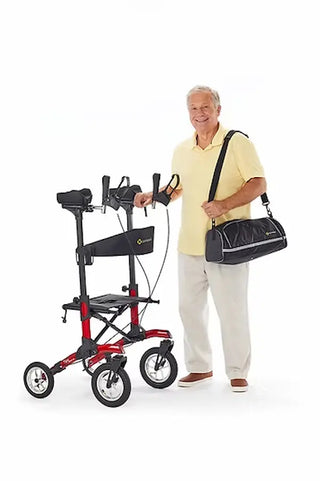 Man holding a red and black walker with a bag on a white background