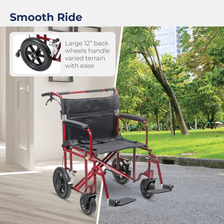 Red and black wheelchair with large back wheels on a paved path with greenery in the background.