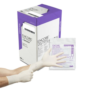 Box of ENCORE® 293295_CS Surgical Glove, Latex Textured, Size 7, Standard Cuff Length, Ivory with a single glove on a white background