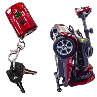 Red car keychain with keys and a small model of a car on a white background
