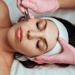 Eco Gloves SoftTouch BLUSH Nitrile Gloves worn during a facial treatment