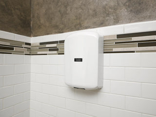 Excel Dryer TA-ABS ThinAir hand dryer featuring a white ABS polymer cover with an ultra slim profile,surface mounted ADA compliant design,and automatic sensor activation. The compact high speed unit offers a clean modern appearance while providing energy efficient hand drying for commercial restroom environments.