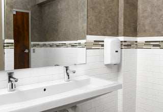 Excel Dryer TA-W ThinAir hand dryer in white epoxy finish with touch-free automatic sensor, surface-mounted design, and compact ADA-compliant profile.
