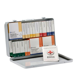 First aid kit with various supplies and an American Red Cross card on a white background