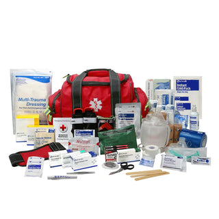 First aid kit with various medical supplies on a white background