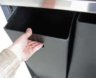 Frost 2021 indoor and outdoor dual-stream waste and recycling receptacle with brushed stainless steel waste inlets, grey powder-coated steel body, and two removable liners.