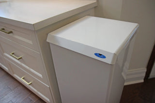 Frost 305 foot operated waste receptacle with hands-free pedal operation, white epoxy-coated steel body, plastic liner, and soft-closing lid.