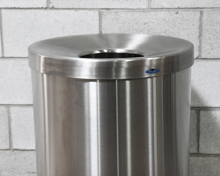 Frost 310 Series lobby waste receptacle available in white powder-coated steel, matte black, and Type 304 brushed stainless steel finishes for commercial facilities.