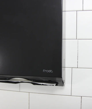 Matte black wall-mounted Frost universal paper towel dispenser with keyed lock, front-loading access, and slim steel construction.