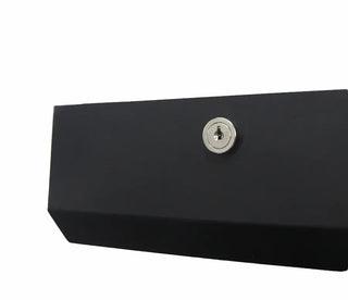 Matte black wall-mounted Frost universal paper towel dispenser with keyed lock, front-loading access, and slim steel construction.