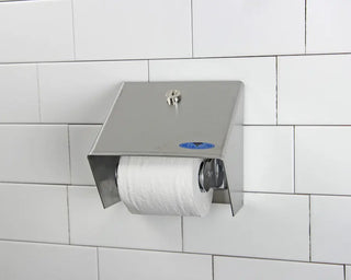 Wall-mounted Frost hooded toilet tissue dispenser with stainless steel hood, polished chrome roll holder, and keyed locking design.